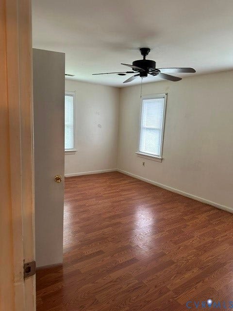 7617 Sunny Bank Drive, Henrico, VA 23228 Room featuring wood-finish flooring, two windows with blinds, and a ceiling fan