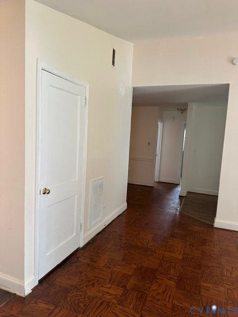 7617 Sunny Bank Drive, Henrico, VA 23228 Parquet wood-finish flooring, white painted walls, and white trim accents