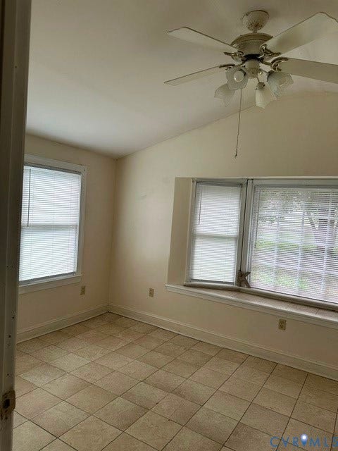 7617 Sunny Bank Drive, Henrico, VA 23228 Vaulted ceiling with an attached ceiling fan and light fixture, tiled flooring, and multiple windows with blinds
