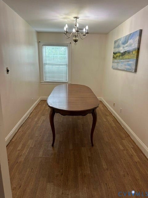7617 Sunny Bank Drive, Henrico, VA 23228 Recessed window, wood-finish flooring, and a chandelier lighting fixture