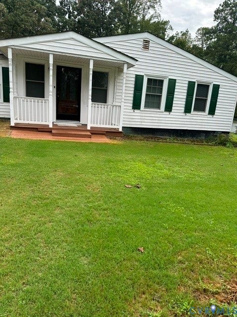 7617 Sunny Bank Drive, Henrico, VA 23228 White siding exterior with a covered front porch, dark green window shutters, and a wooden front door