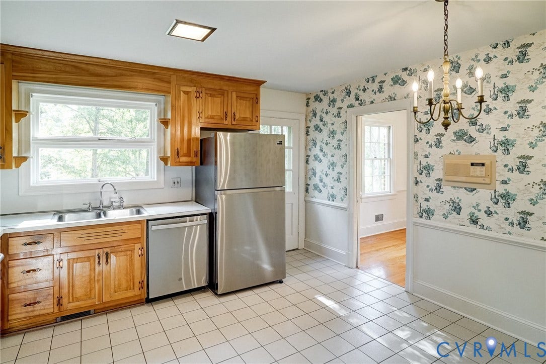 1407 W Monmouth Court, Henrico, VA 23238 Eat in kitchen featuring wood cabinetry, stainless steel appliances, a double basin sink, and tile flooring