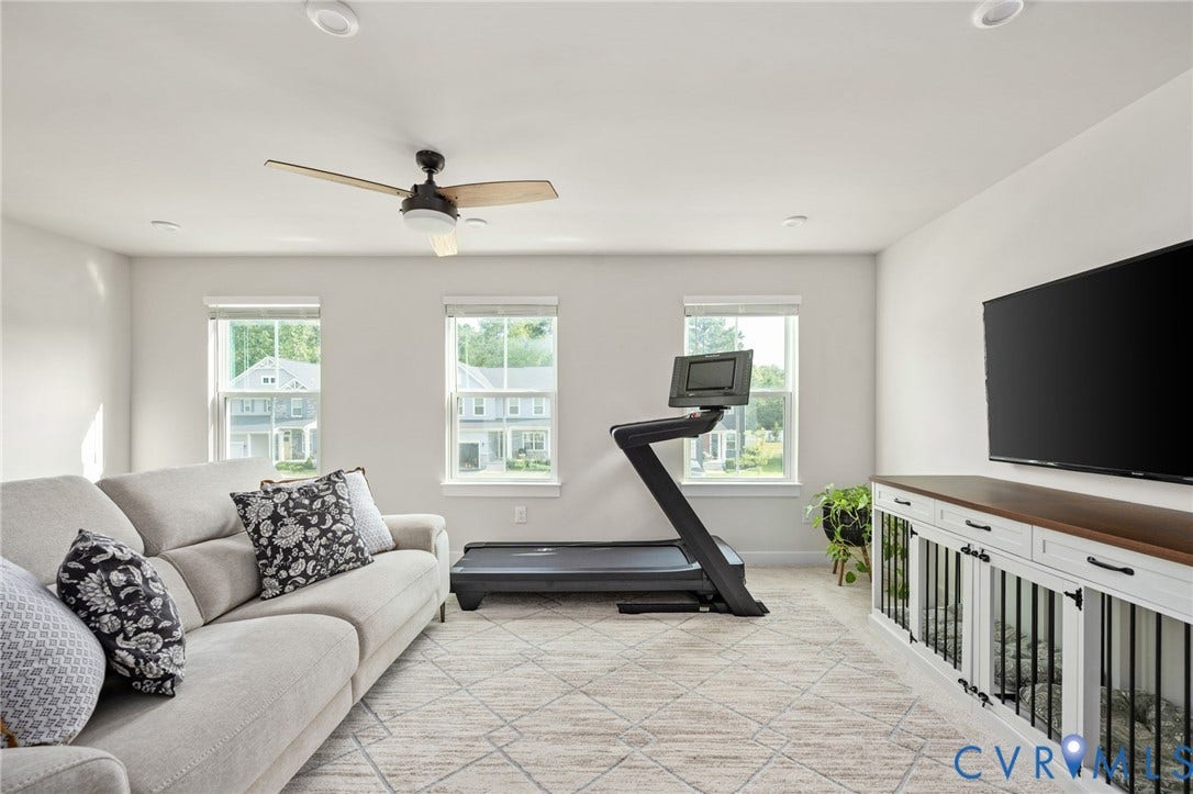 1961 Enon Station Drive, Chester, VA 23836 Recessed lighting, wood-finish ceiling fan, multiple windows, built-in media console, wall-mounted television