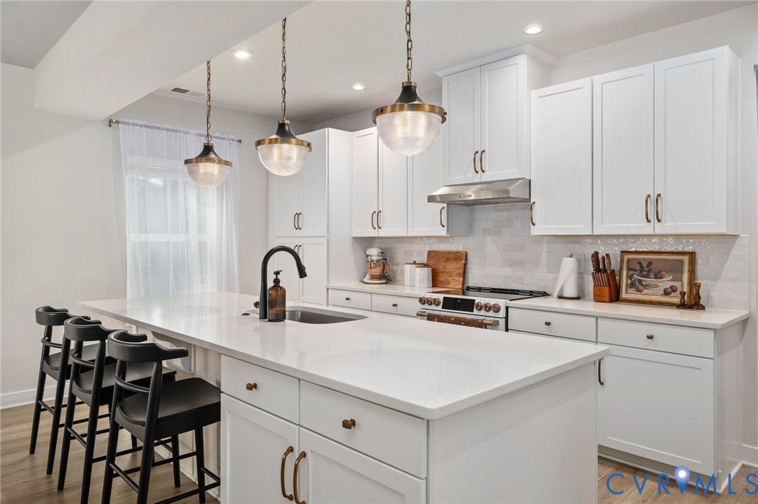 1961 Enon Station Drive, Chester, VA 23836 White cabinetry kitchen featuring a center island, pendant lighting, stainless steel appliances, and a tile backsplash