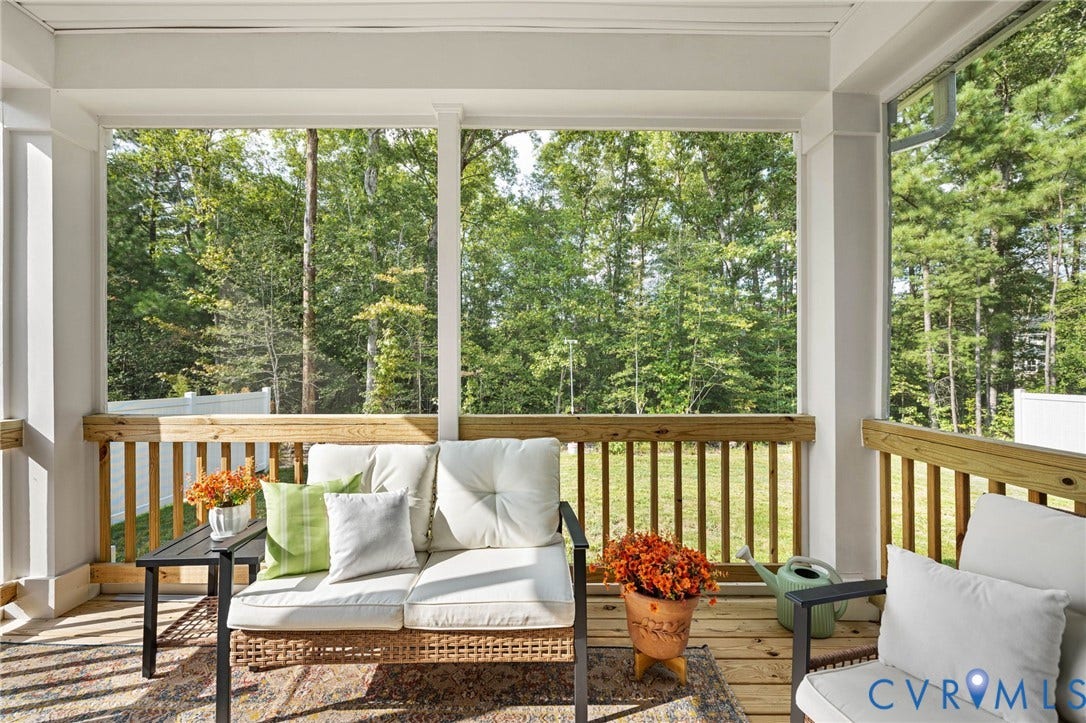 1961 Enon Station Drive, Chester, VA 23836 Covered porch with wood-finish decking, white columns, and wood railings