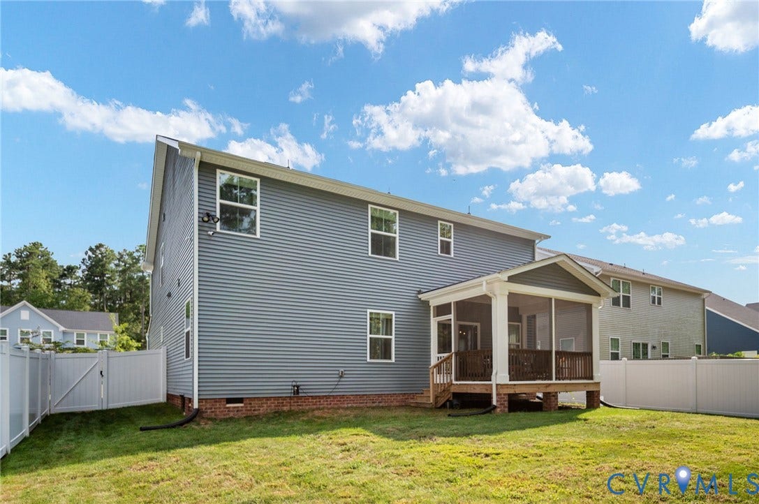1961 Enon Station Drive, Chester, VA 23836 Two-story residence with blue siding and white trim