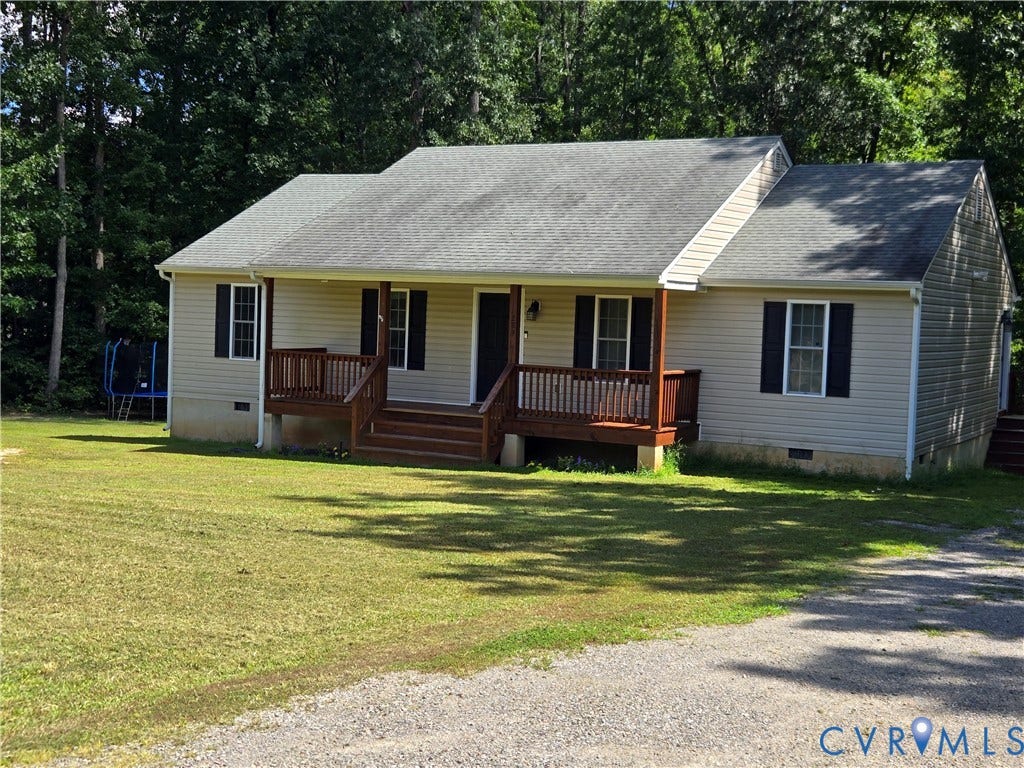 289 Winding Ridge Way, Winding Ridge, Bumpass, VA 23024 Ranch-style residence featuring light-colored siding, a covered porch with a wood-finish railing, and dark louvered shutters
