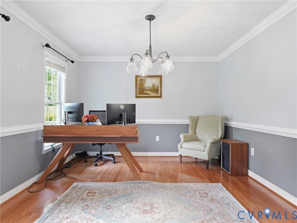 8325 Caroline Vines Way, Estates At Willis Church, Henrico, VA 23231 Hardwood flooring, crown molding, chair rail molding, ceiling-mounted chandelier, and window with exterior visibility