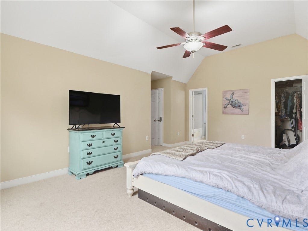 8325 Caroline Vines Way, Estates At Willis Church, Henrico, VA 23231 Vaulted ceiling with a ceiling fan, carpet flooring, and a walk-in closet