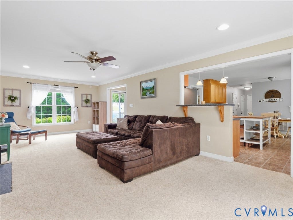 8325 Caroline Vines Way, Estates At Willis Church, Henrico, VA 23231 Carpeted living area featuring a ceiling fan, recessed lighting, and a large window