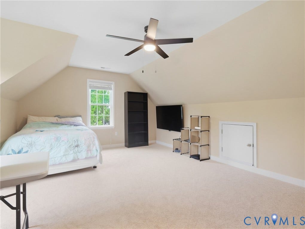 8325 Caroline Vines Way, Estates At Willis Church, Henrico, VA 23231 Carpeted room featuring an angled ceiling, a ceiling fan with integrated lighting, a window, and an access door