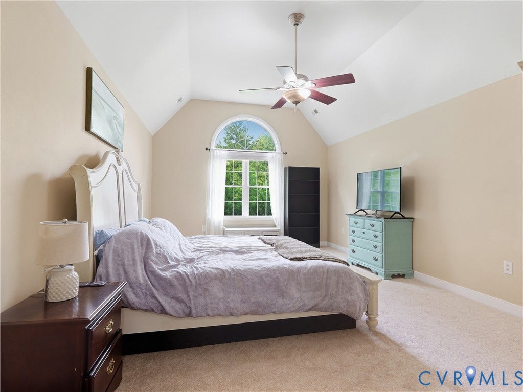 8325 Caroline Vines Way, Estates At Willis Church, Henrico, VA 23231 Vaulted ceiling with an arched window, ceiling fan, and carpeted flooring