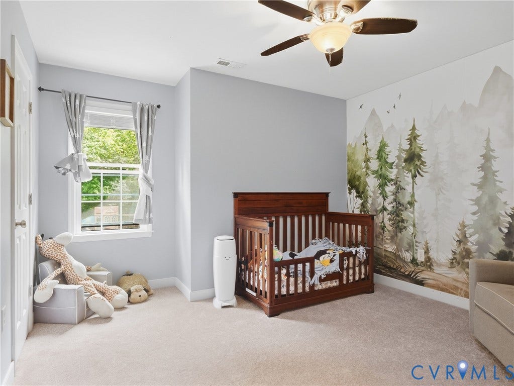 8325 Caroline Vines Way, Estates At Willis Church, Henrico, VA 23231 Wall-to-wall carpeting, window with grid panes, ceiling fan light fixture, painted walls, and built-in closet with white paneled door