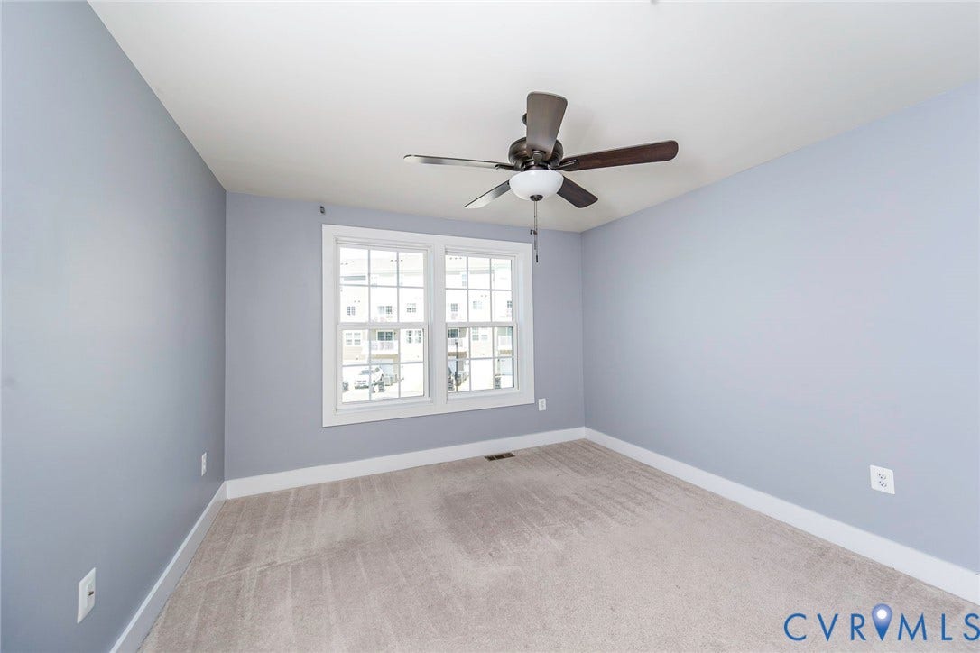 4300 Bon Secours Parkway, #A, Henrico, VA 23233 Light grey carpet, white trim, and a ceiling fan with light fixture