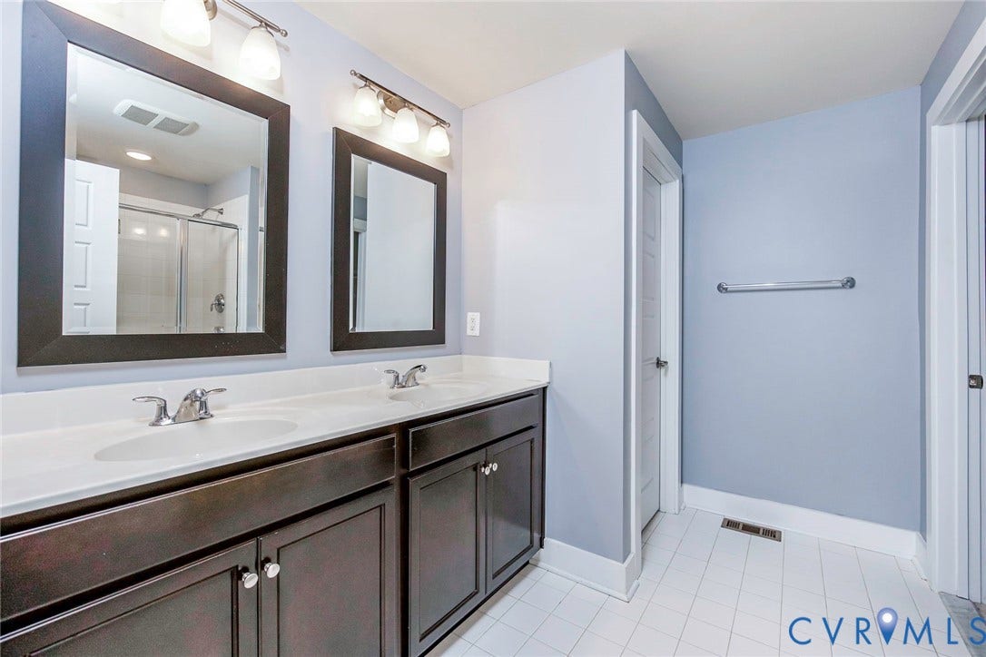 4300 Bon Secours Parkway, #A, Henrico, VA 23233 Dual vanity with dark wood-finish cabinetry and white countertops