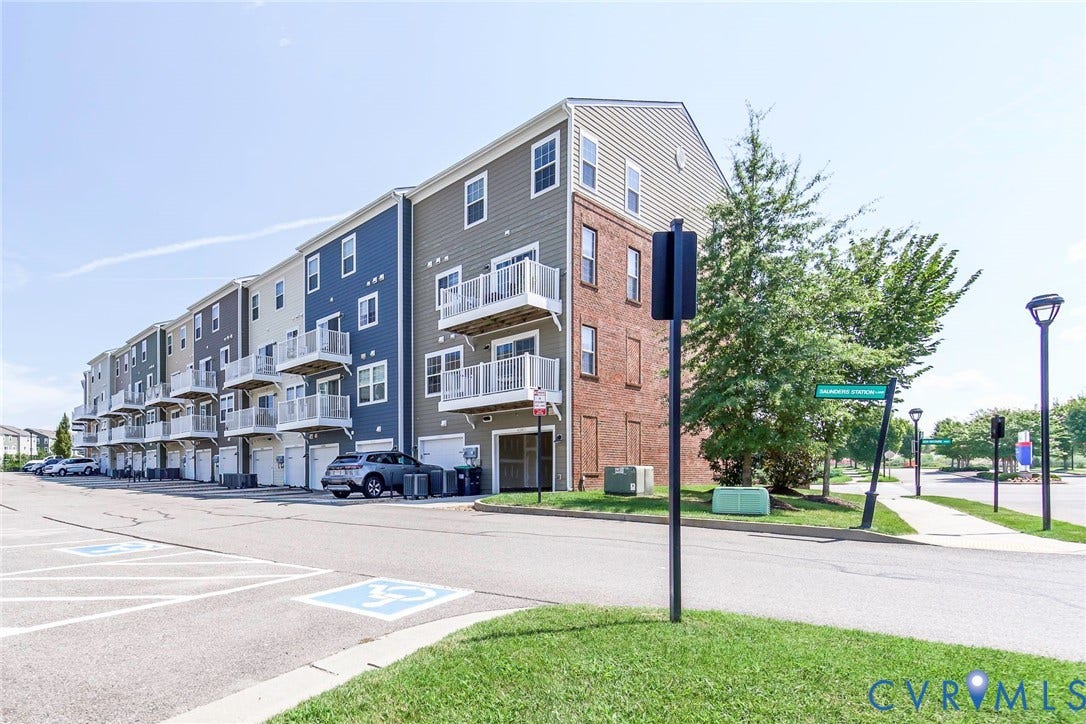 4300 Bon Secours Parkway, #A, Henrico, VA 23233 Multi-story residential building with varied siding, individual balconies with white railings, and integrated garage bays