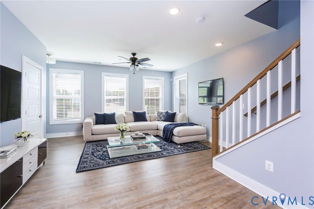 4300 Bon Secours Parkway, #A, Henrico, VA 23233 Spacious living area featuring wood-finish flooring, a ceiling fan, and multiple windows