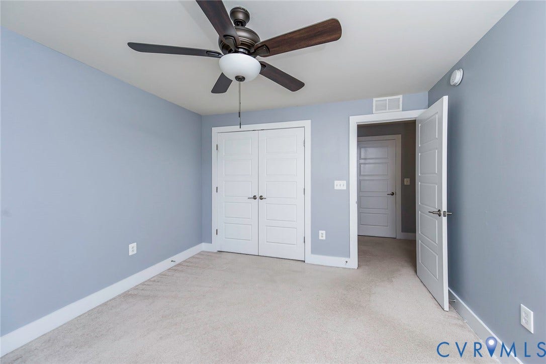 4300 Bon Secours Parkway, #A, Henrico, VA 23233 White interior doors, light-toned carpeting, ceiling fan with light fixture, and light blue wall finish