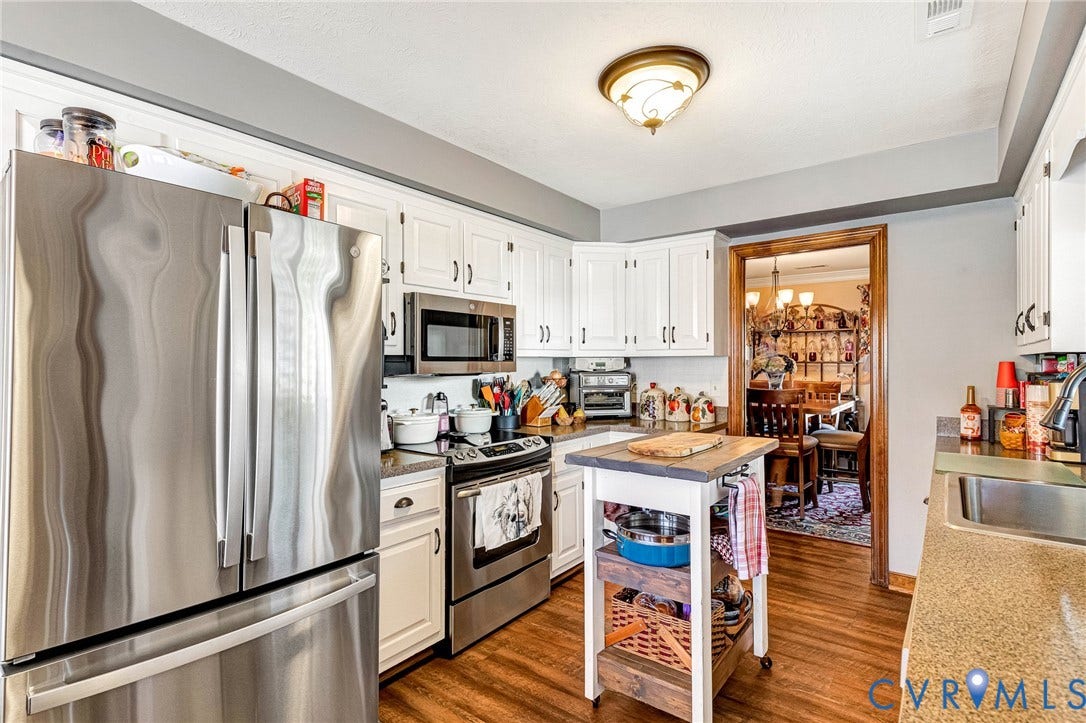 White cabinetry with dark hardware