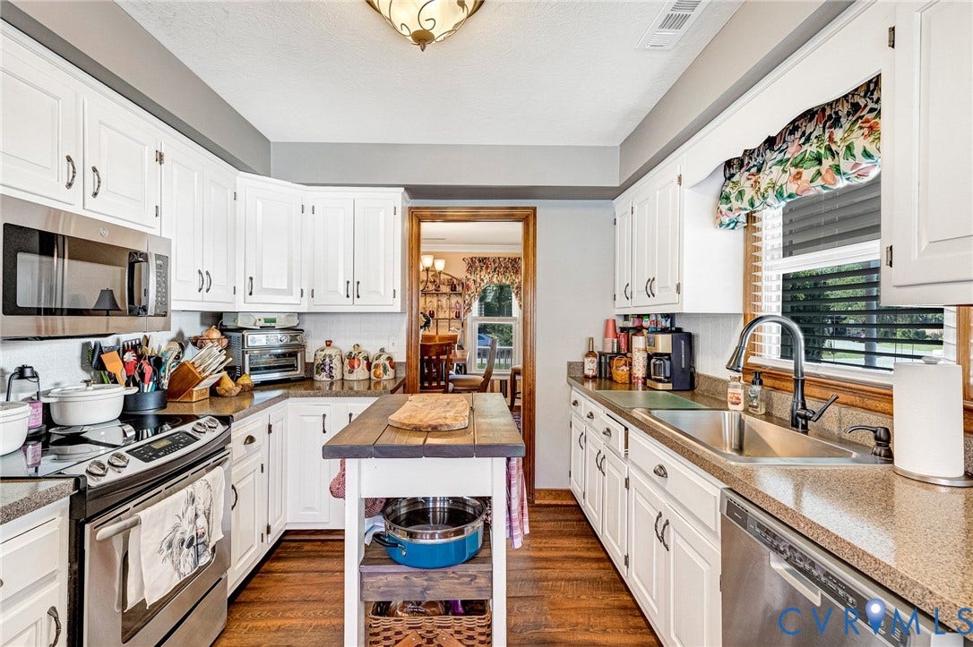 White cabinetry with dark hardware