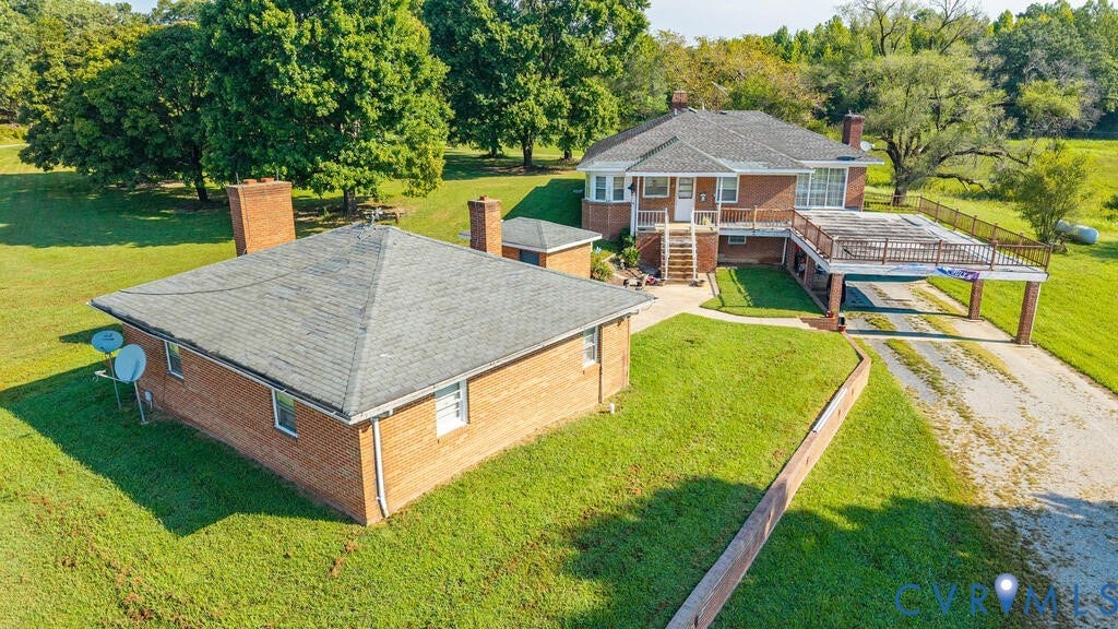 21 Vanderpool Lane, Detached, Cumberland, VA 23040 Brick exterior with multiple chimneys, surrounded by expansive green lawn