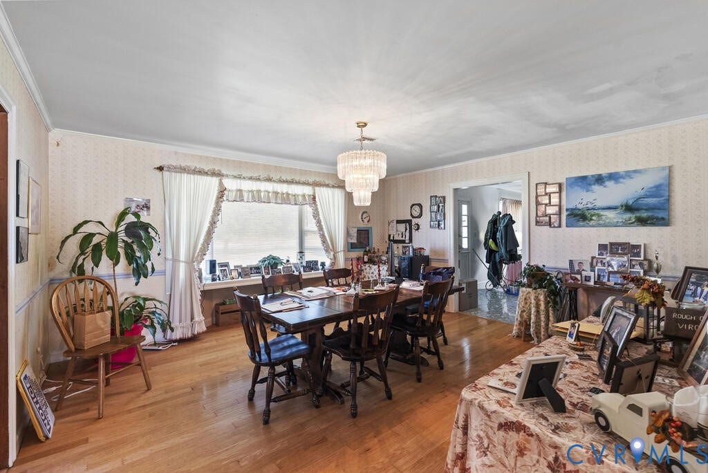 21 Vanderpool Lane, Detached, Cumberland, VA 23040 Hardwood flooring, large picture window, ornate chandelier, crown molding, and an arched doorway