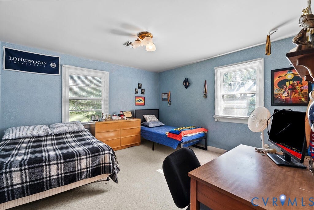 21 Vanderpool Lane, Detached, Cumberland, VA 23040 Carpeted room featuring multiple windows, a wood dresser, and a ceiling-mounted light fixture