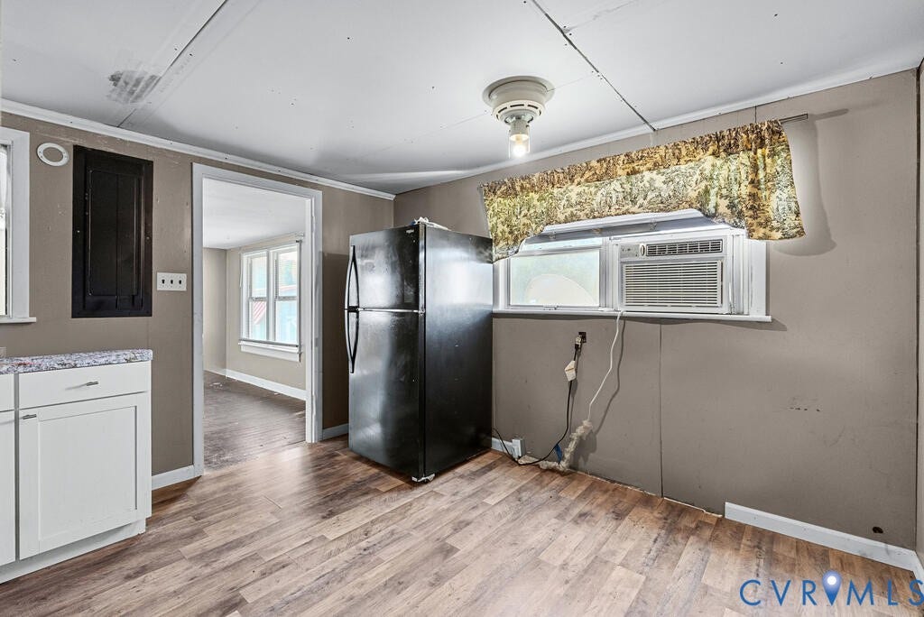 21 Vanderpool Lane, Detached, Cumberland, VA 23040 Wood-finish flooring with white base trim, white cabinetry, and a refrigerator