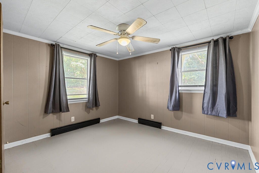 21 Vanderpool Lane, Detached, Cumberland, VA 23040 Paneled walls, two windows with trim, ceiling fan light fixture, and painted flooring