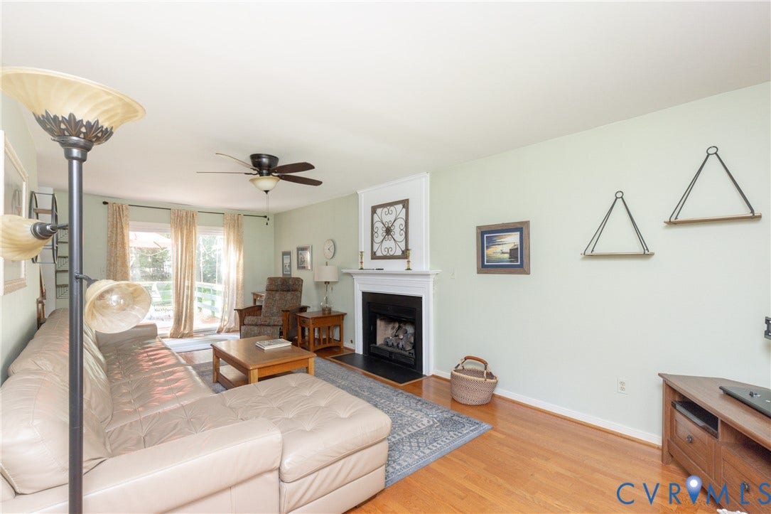 13802 Rockhaven Drive, Thornhill, Chester, VA 23836 Hardwood flooring, fireplace with mantel, ceiling fan, and sliding glass doors