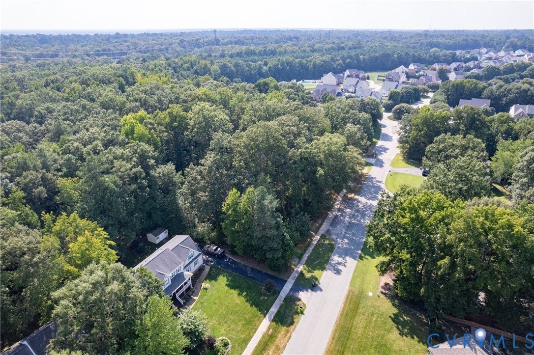 13802 Rockhaven Drive, Thornhill, Chester, VA 23836 Suburban neighborhood with mature trees, paved streets, and residential properties