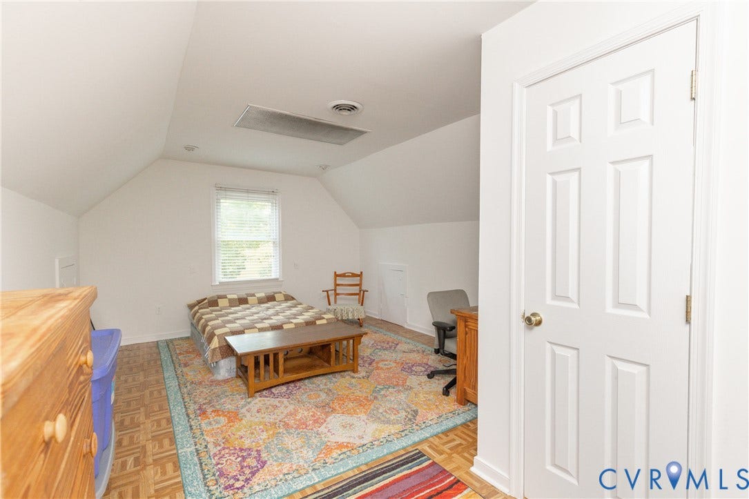 13802 Rockhaven Drive, Thornhill, Chester, VA 23836 Vaulted ceiling with recessed lighting, single window with blinds, panel door with brass hardware, and wood-finish flooring