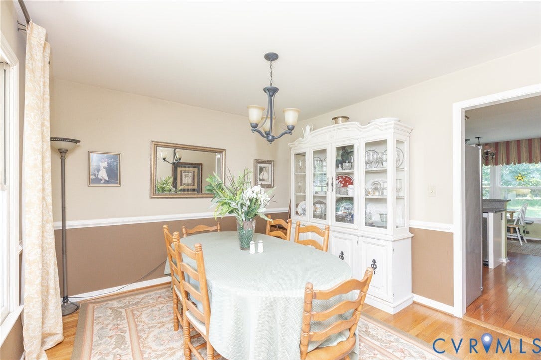 13802 Rockhaven Drive, Thornhill, Chester, VA 23836 Hardwood flooring, chair rail molding, and a chandelier with three frosted glass shades