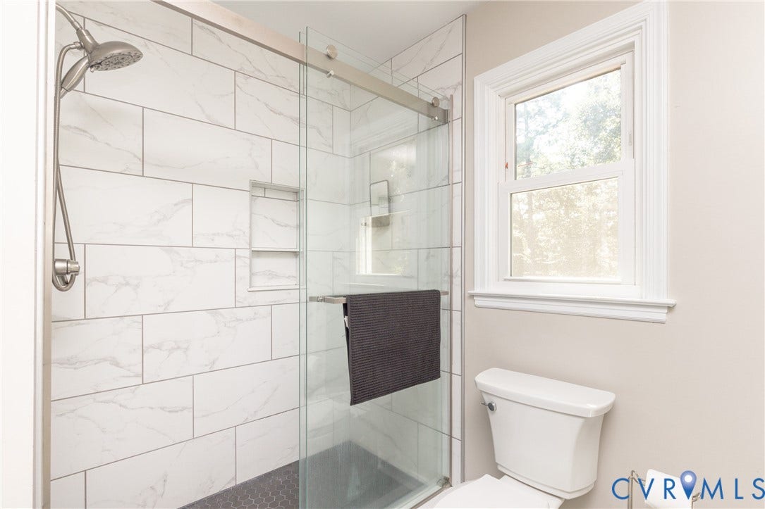 13802 Rockhaven Drive, Thornhill, Chester, VA 23836 Glass-enclosed shower with subway tile surround, recessed shower niche, and hex tile shower pan