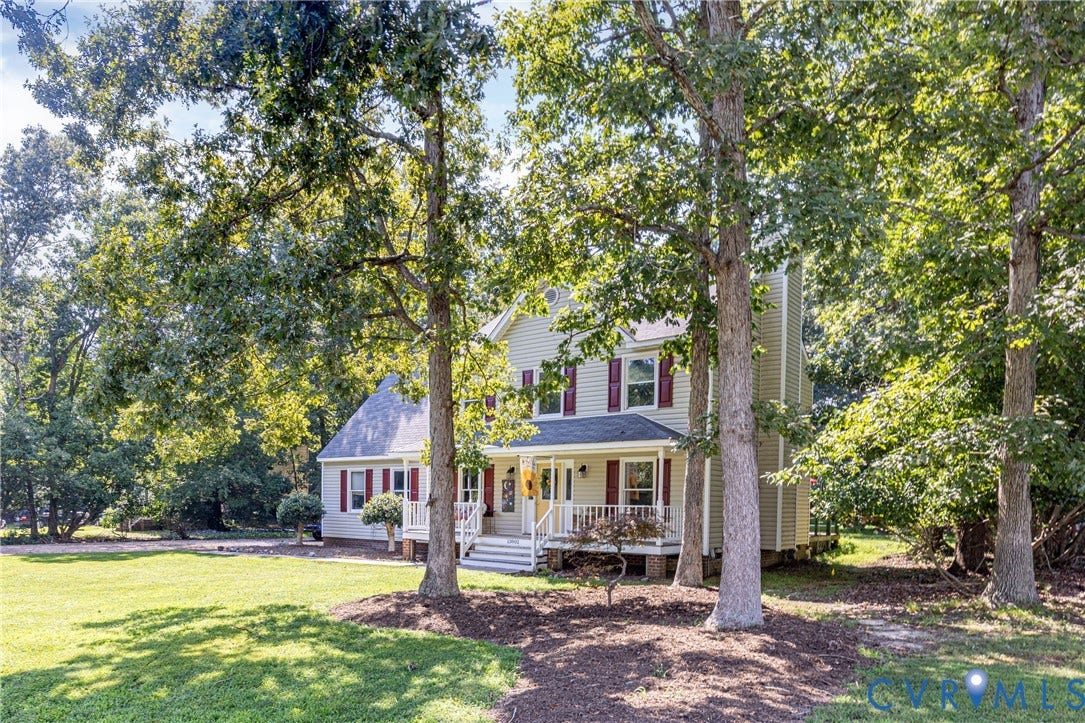 13802 Rockhaven Drive, Thornhill, Chester, VA 23836 Two-story exterior with light-colored siding, red window shutters, a covered front porch, and a dormer window