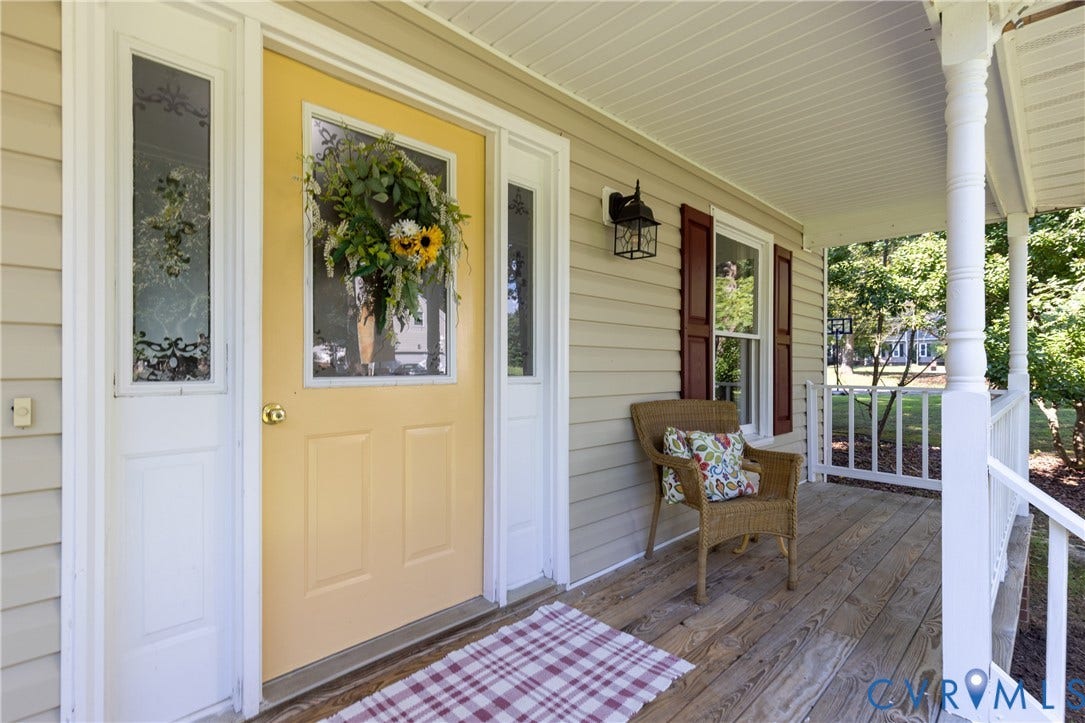 13802 Rockhaven Drive, Thornhill, Chester, VA 23836 Covered front porch featuring wood-finish flooring, white railing, and decorative columns