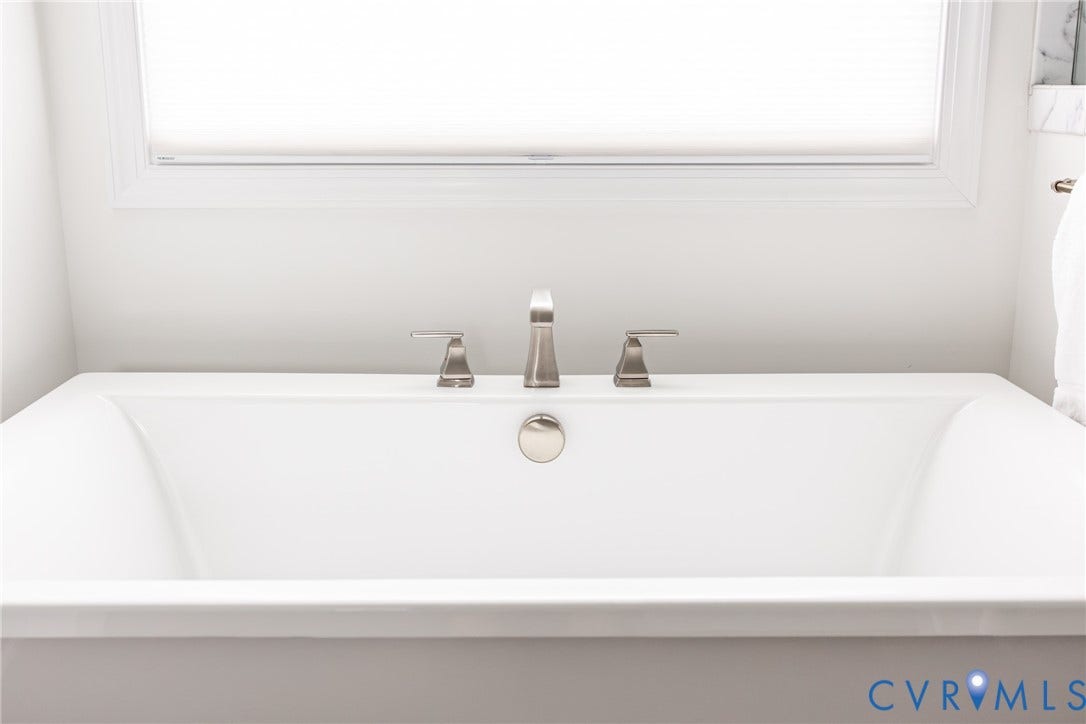 Luxurious free standing soaking tub.