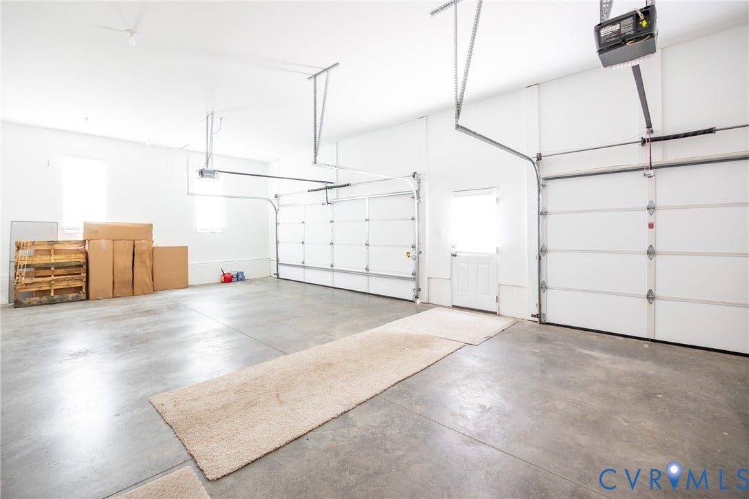 Alternate view of large garage with pedestrian door.