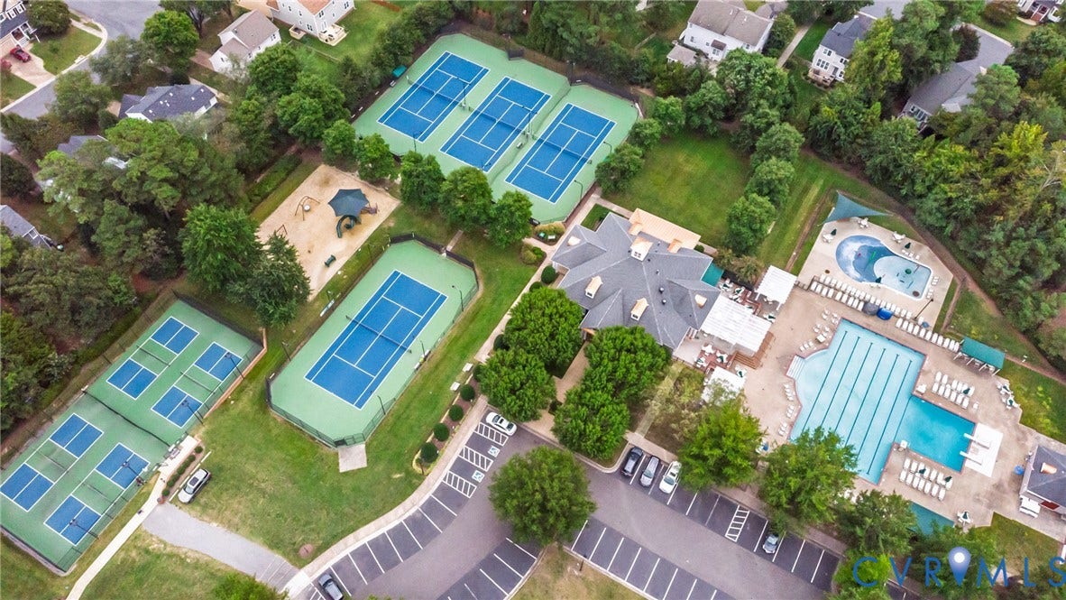 Amenities also include multiple tennis courts, pickleball courts, a central clubhouse and a dedicated playground area.