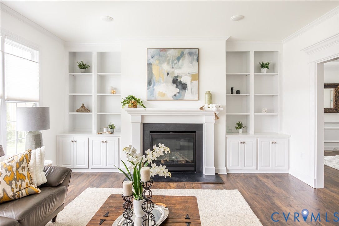 Family room with gas fireplace and built-ins for decor and storage.