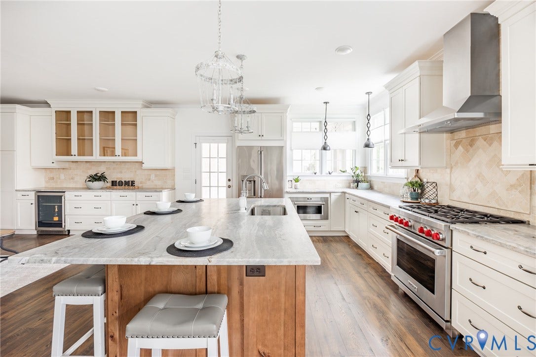 Alternate view of the kitchen that has so much space for cooking and entertaining. Note the 36" gas cooktop, extra wide WOLF oven that holds 6 casserole dishes as well as the WOLF speed oven at the far end next to the Cafe refrigerator.