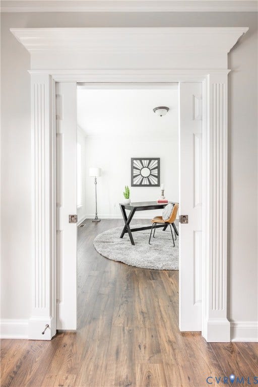 As you enter the home, to the left is the large light filled office with pocket doors for privacy.