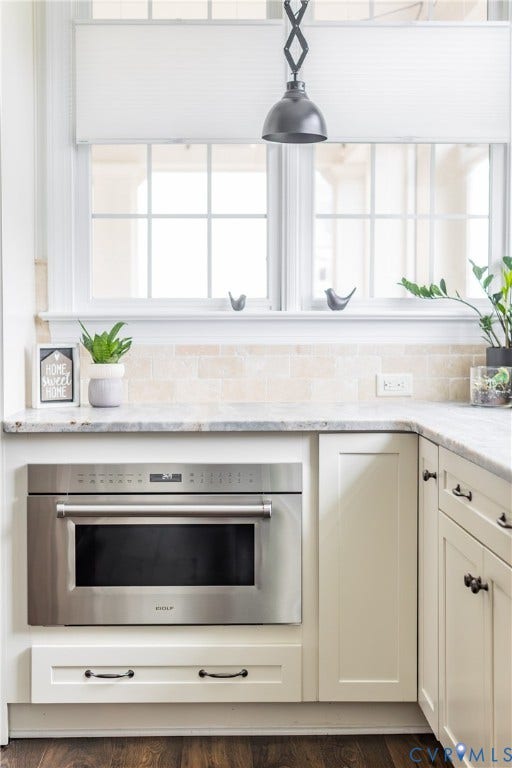 The kitchen is equipped with a WOLF speed oven - an all-in-one luxury appliance that combines microwave speed with convection baking.