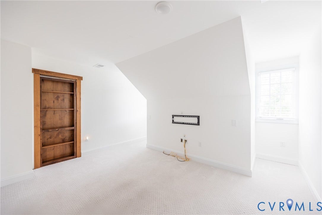Bonus room with fun Murphy door with shelving that leads to a hidden room.