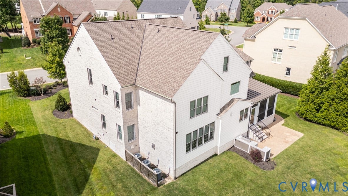 Side and back aerial view of the home.