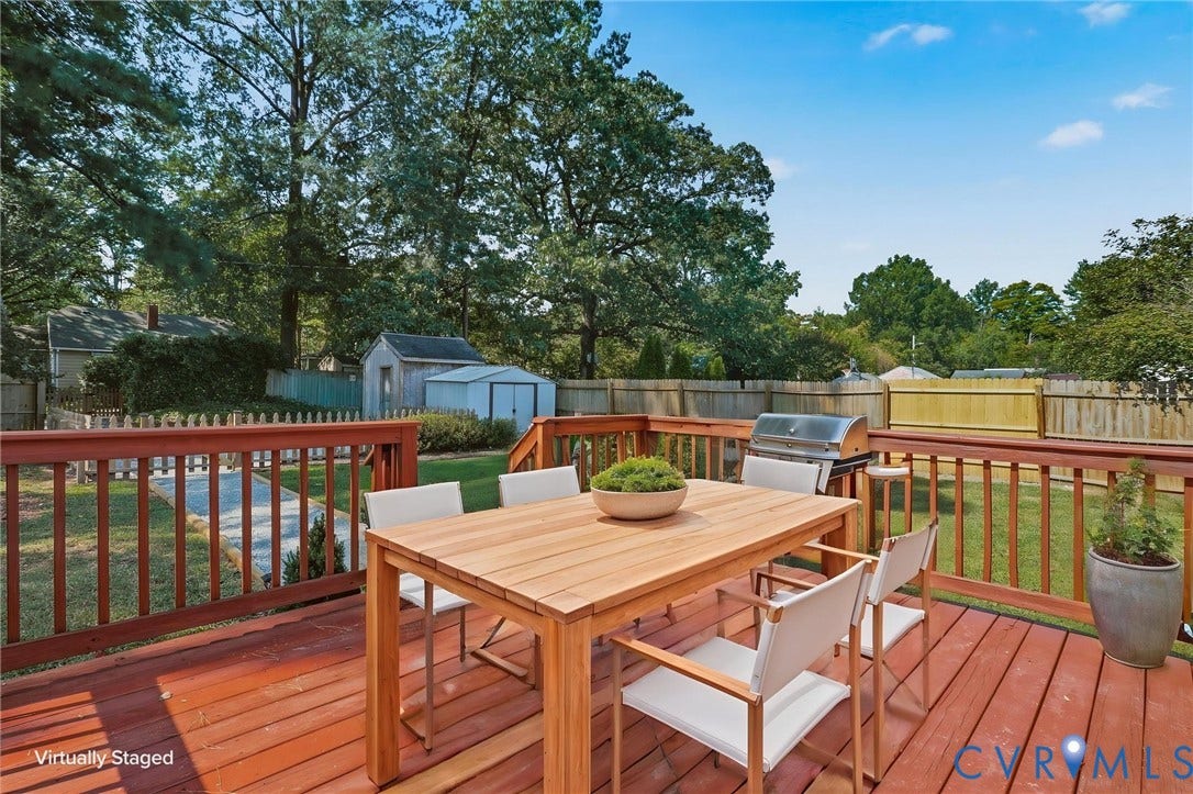 5108 Forest Hill Avenue, Westover Hills Area, Richmond, VA 23225 Expansive wooden deck with a red-stained finish, featuring a surrounding railing, and overlooking a green lawn