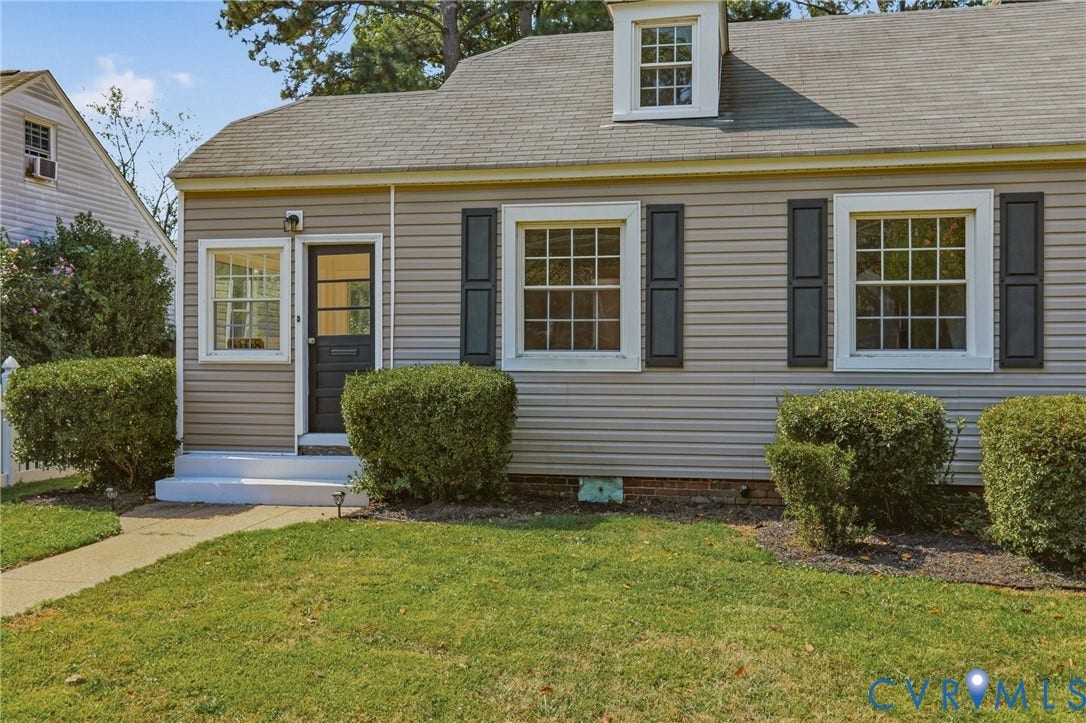 5108 Forest Hill Avenue, Westover Hills Area, Richmond, VA 23225 Light gray siding exterior with dark shutters, white trim, and a dormer window