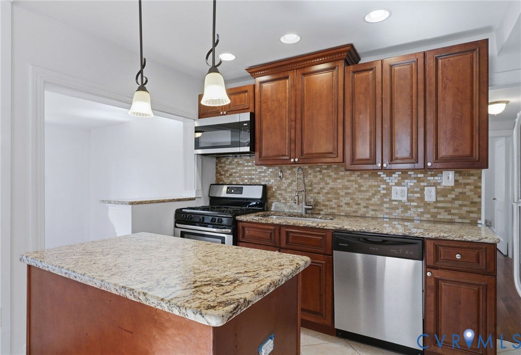 5108 Forest Hill Avenue, Westover Hills Area, Richmond, VA 23225 Kitchen featuring Island, wood cabinetry, granite countertops, stainless steel appliances, a tiled backsplash, and recessed lighting.