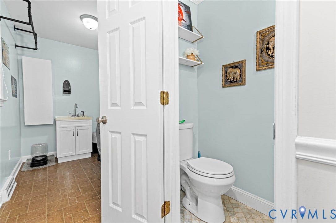 White panel door with brass-finish hinges