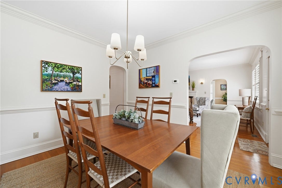 1500 Avondale Avenue, Bellevue, Richmond, VA 23227 Crown molding and chair rail detailing, wood-finish flooring, and an arched entryway